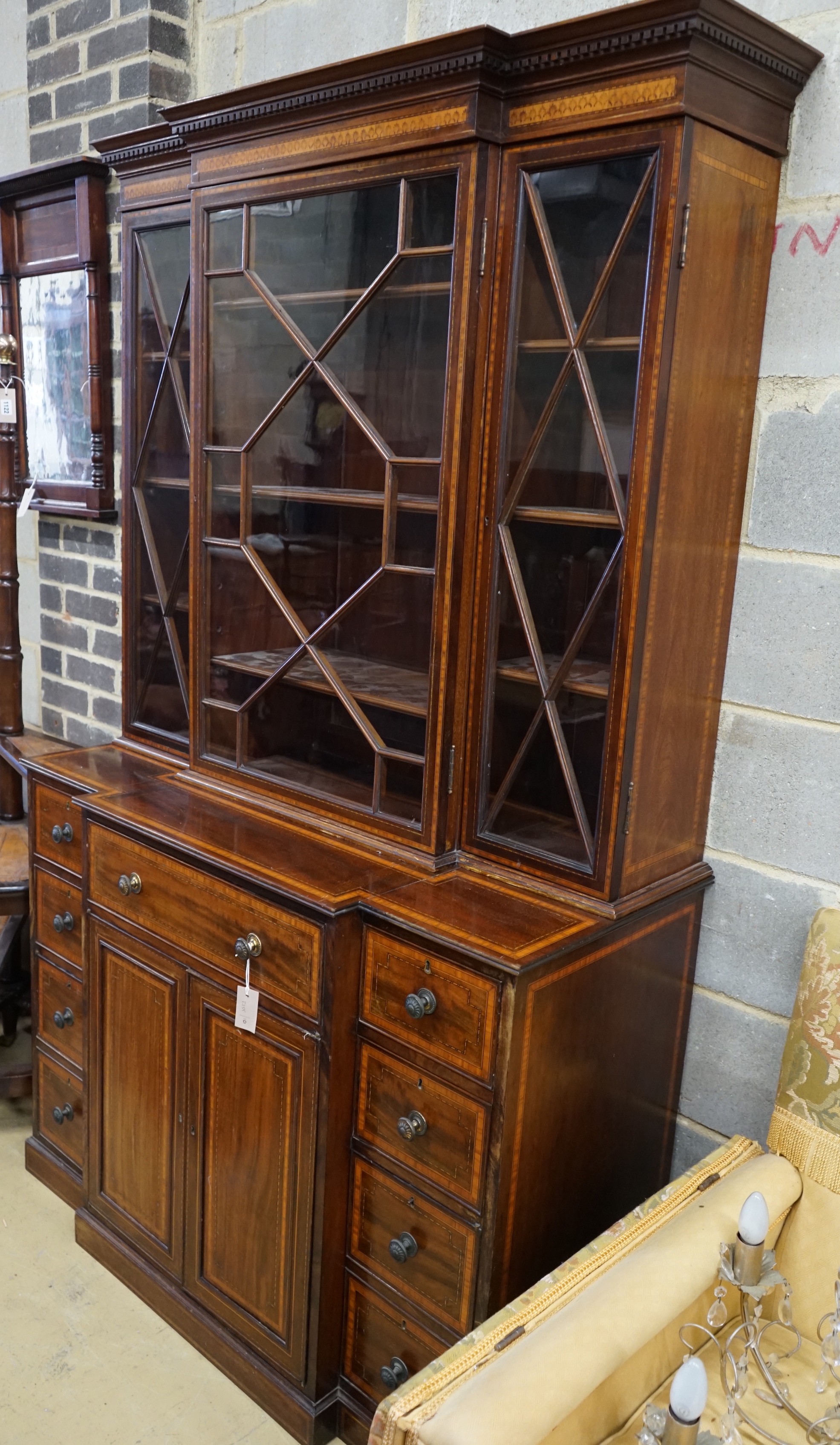 A small Edwardian satinwood banded mahogany breakfront bookcase, length 120cm, depth 55cm, height 201cm